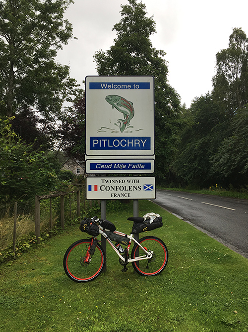 Bike leaning against Pitlochry sign